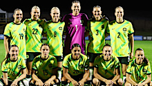 Matildas take a team photo before their clash with Haiti.
