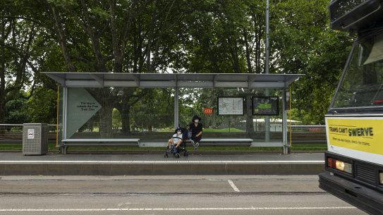 A quiet tram stop on St Kilda Road. Public transport usage dropped considerably this week amid concerns over the spread of coronavirus. 