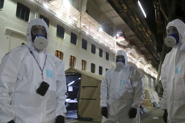 Police officers prepared to board the Ruby Princess to seize evidence for an investigation while it was docked in Wollongong. 