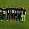 The German soccer team stage a protest at the start of their World Cup qualifier against Iceland in March 2021.