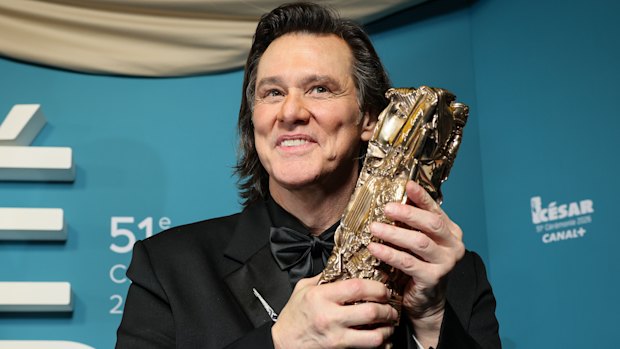 Jim Carrey poses after receiving the Cesar of Honour award during the 51th Cesar Awards ceremony in Paris.