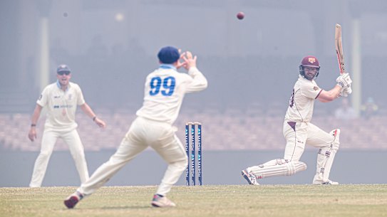 Mathew Gilkes picks the ball out through the smoke to take the catch and dismiss Michael Neser off Harry Conway. 