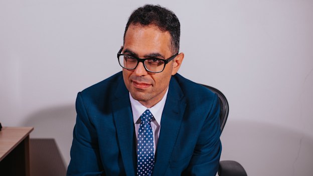 Daniel Mookhey is dressing like his predecessors but has a very different background.