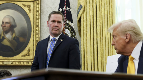 White House national security adviser Mike Waltz listens to President Donald Trump in the Oval Office on March 7.