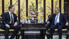 Visiting Tesla founder and CEO Elon Musk, left, meets with Chinese Premier Li Qiang in Beijing on Sunday.