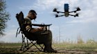 FILE — A Ukrainian drone pilot in the Kharkiv region of northeastern Ukraine on April 24, 2025. Ukraine has modified Chinese-made hobbyist drones for military use against the Russians.