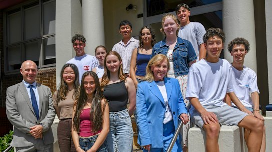 Casimir Catholic College principal Carmelina Eussen (in blue suit) with students after HSC results were released.