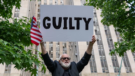 People celebrate after former president Donald Trump was found guilty on all counts at Manhattan Criminal Court on Thursday.