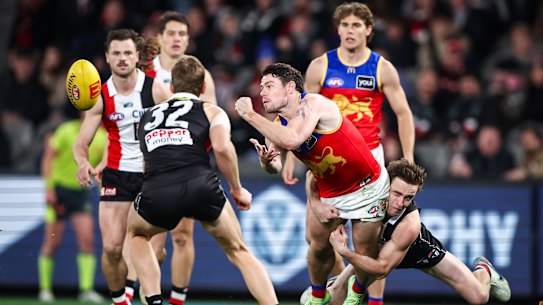 Lachie Neale is tackled by St Kilda’s Ben Paton.
