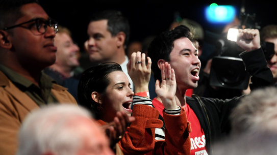 Labor supporters reacts as they watch the television broadcast during the Labor Party election night event at Canterbury-Hurlstone Park RSL Club.