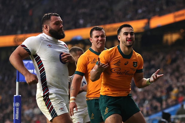 Tom Wright of Australia celebrates scoring his team's first try.