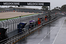 Fans had been waiting in torrential rain for any track action. 