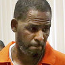 R. Kelly leaves a hearing in Chicago.