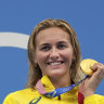 Ariarne Titmus of Australia holds up her gold medal 