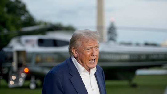 President Donald Trump speaks with reporters after disembarking Marine One upon arrival on the South Lawn of the White House in Washington, Sunday, May 4, 2025. (AP Photo/Rod Lamkey, Jr.)
