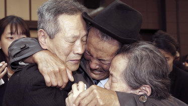 North Korean Son Kwon-geun, centre, weeps with his South Korean relatives as he bids them farewell at Diamond Mountain resort in North Korea at the end of last reunion, in 2015.