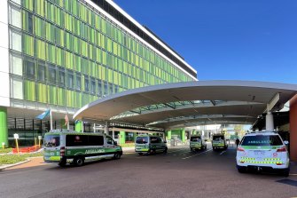 Ambulances wait outside of the emergency department at Sir Charles Gairdner Hospital. 