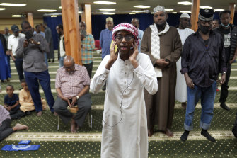 Dalha Abdi, 15, calls the adhan, or Islamic call to prayer at the Abubakar As-Saddique Islamic Centre in south Minneapolis.