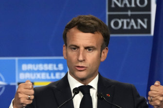 French President Emmanuel Macron speaks at the end of a NATO summit in Brussels.