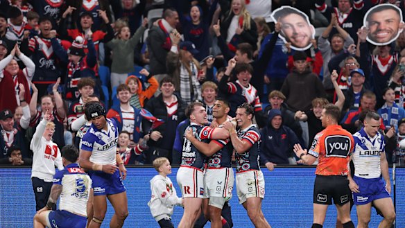 Daniel Tupou celebrates a try for the Roosters.