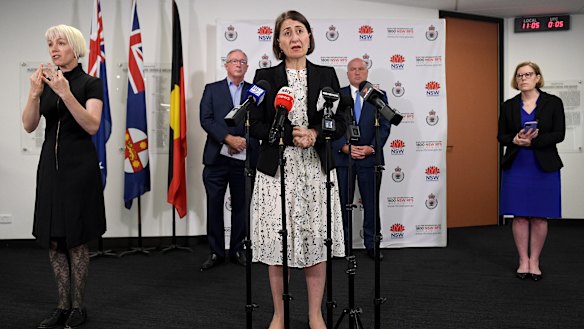 Premier Gladys Berejiklian with Health Minister Brad Hazzard, Police Minister David Elliott and Chief Health Officer Dr Kerry Chant.