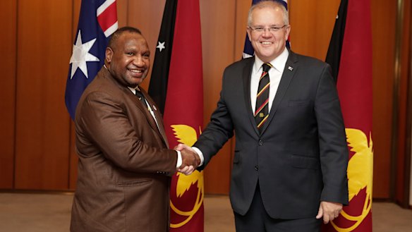 Prime Minister Scott Morrison was due to meet PNG PM James Marape, left, next week.