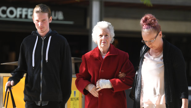Darren Pullar's partner Collette Dunn (right) and his son Aidan (left) arriving at the Supreme Court in Brisbane on Friday. Alexander Craig Price Kirke, 19, was sentenced to nine years in prison for the manslaughter of the Gold Coast father.