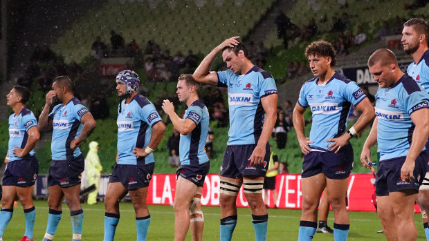 Rob Simmons (hand on head)  and Waratahs players look on during their round three loss to the Melbourne Rebels. 