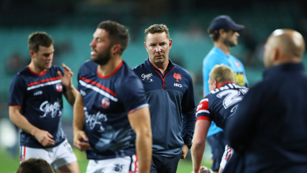 Adam O'Brien looks on as the Roosters warm up before their game against the Panthers.