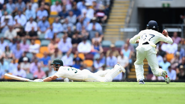 Haseeb Hameed misses the stumps in an attempt to run out David Warner, with the Australian opener stranded. 