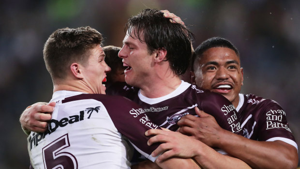 Jack Gosiewski and the Sea Eagles celebrate the back-rower's try on Friday night.