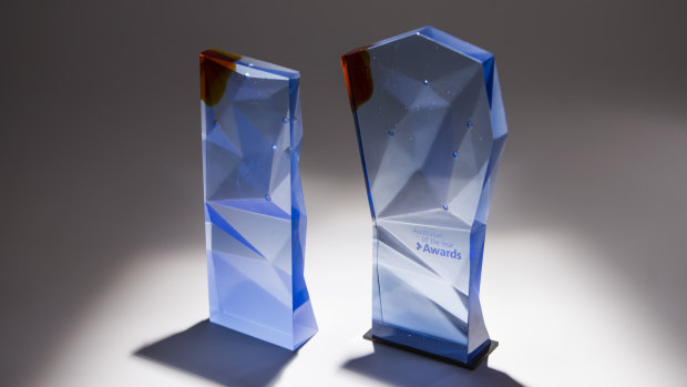 The Australian of the Year state (left) and national (right) trophies. 