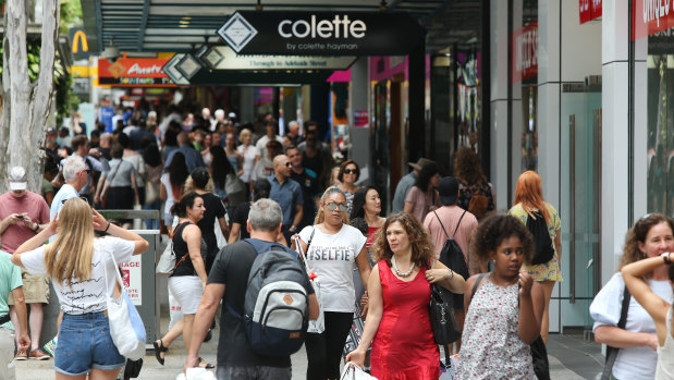 Christmas shopping in Brisbane's Queen Street Mall, where retail space costs thousands per square metre.