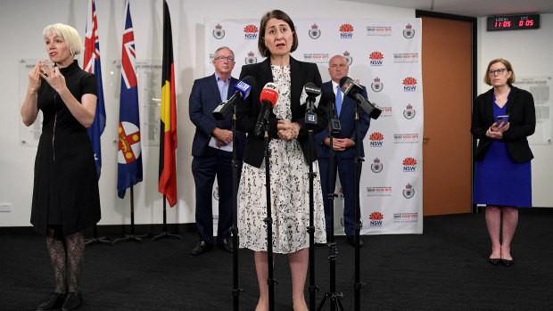 Premier Gladys Berejiklian with Health Minister Brad Hazzard, Police Minister David Elliott and Chief Health Officer Dr Kerry Chant.