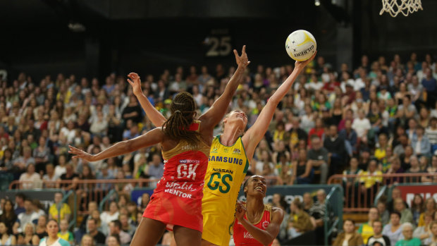 Stretched: Caitlin Bassett reaches for the ball at Newcastle Entertainment Centre. 