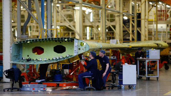 Employees put together Airbus A320 wings inside the A320/A330 wing assembly building at Airbus' assembly plant in Broughton, UK. The wings are then shipped to the company's Toulouse site for final assembly.
