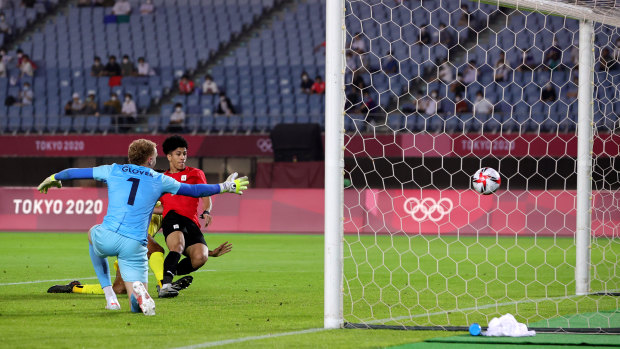 Ammar Hamdy of Egypt scores their side’s second goal past Thomas Glover of the Olyroos.