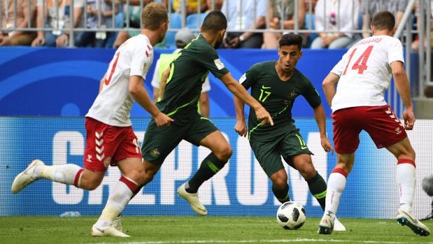 Second wind: Daniel Arzani and Aziz Behich go on the attack in the dying stages against Denmark.