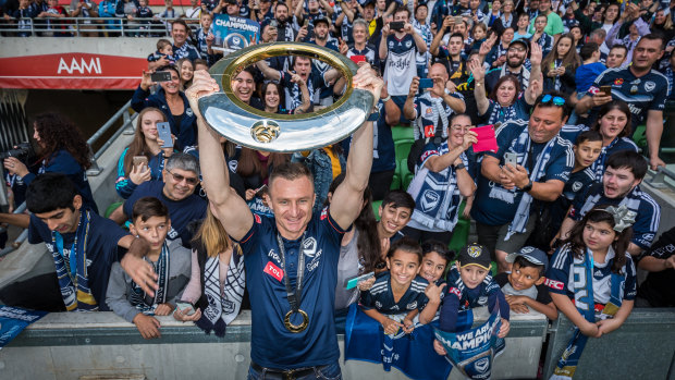 Melbourne Victory fans celebrate their team's grand final win. 