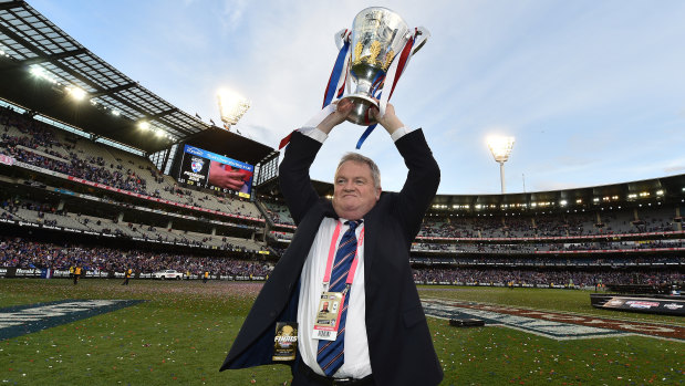 Peter Gordon, pictured here with the 2016 premiership cup, was furious when the Dogs weren't picked to play on Good Friday in 2018. 