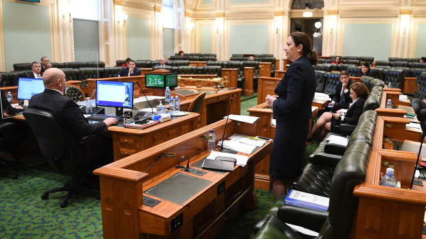 Queensland Premier Annastacia Palaszczuk addresses an almost-empty chamber.