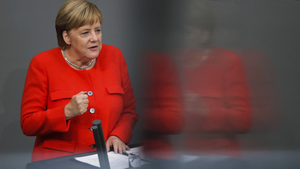 German Chancellor Angela Merkel delivers her speech during a plenary session of the Bundestag on Wednesday.