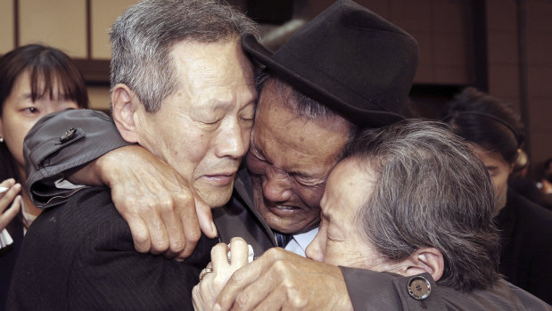 North Korean Son Kwon-geun, centre, weeps with his South Korean relatives as he bids them farewell at Diamond Mountain resort in North Korea at the end of last reunion, in 2015.