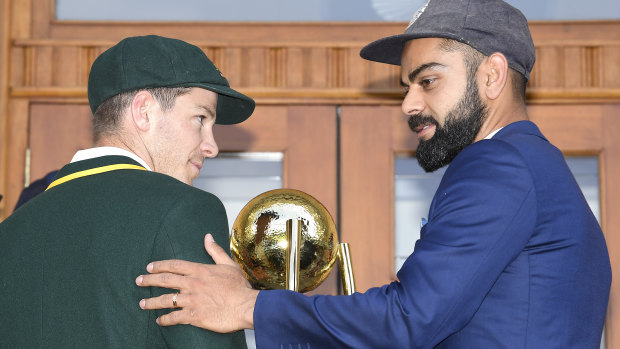 Australian captain Tim Paine and his Indian counterpart Virat Kohli with the Border-Gavaskar Trophy.