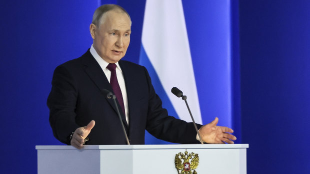 Russian President Vladimir Putin gestures as he gives his annual state of the nation address in Moscow.