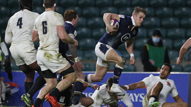 Scotland’s Duhan van der Merwe charges to the line to score a try during the Six Nations rugby union international between England and Scotland at Twickenham stadium in London, Saturday, Feb. 6, 2021.