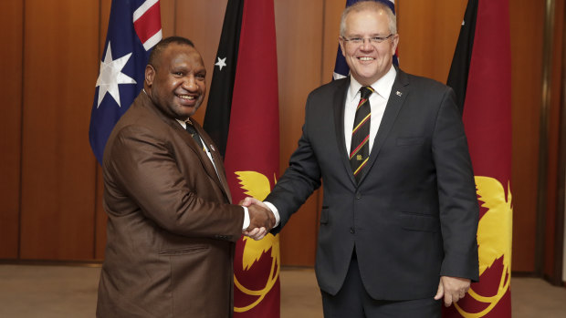 Prime Minister Scott Morrison was due to meet PNG PM James Marape, left, next week.