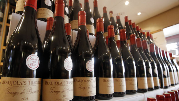 Bottles of Beaujolais Nouveau wine are displayed in a wine store at Issy Les Moulineaux, outskirts of Paris.
