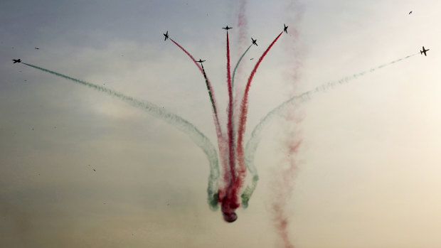 Pakistani  fighter jets perform an aerobatic stunt during an air show this year.