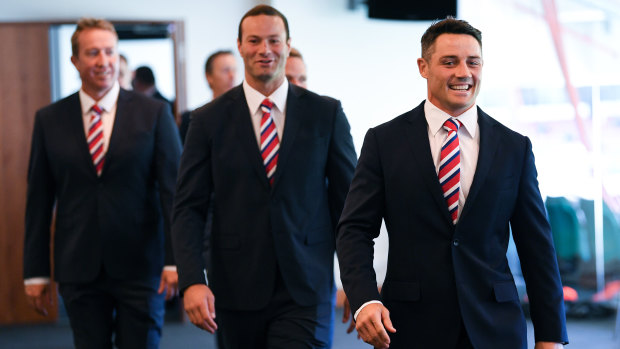 All smiles: Boyd Cordner, Trent Robinson and Cooper Cronk attend a grand final media conference on Thursday. 